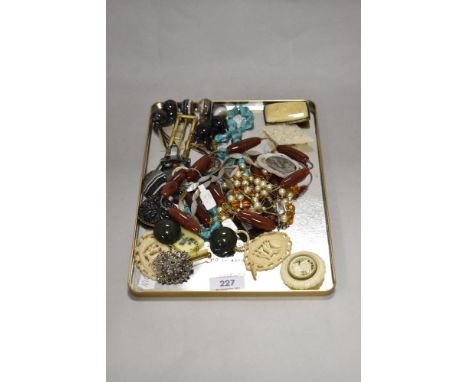 A tray of assorted costume jewellery, to include a carved Bakelite dress brooch, a turquoise nugget form necklace, and an Art