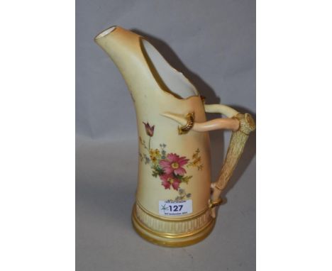 A Royal Worcester tusk jug, on blush ivory ground, with floral design, stamped '1116' to the base, and measuring 23cm tall