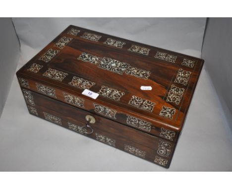A late Victorian rosewood writing slope, having extensive Mother of Pearl inlaid detailing and escutcheon, two ink wells and 