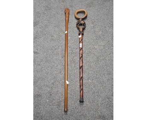 A mid-century African elephant walking stick, 90cm long, together with a tribal carved staff