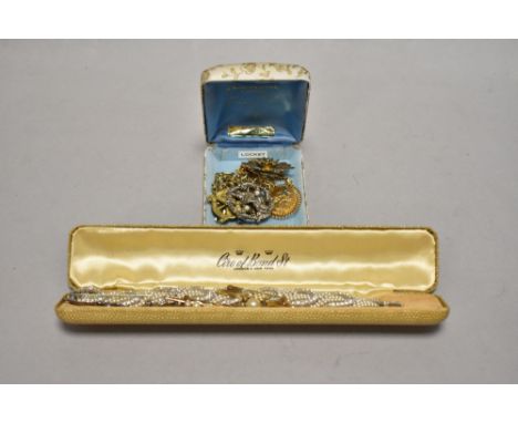 An early 20th Century diamante and seed pearl style bracelet, a silver gilt and simulated pearl brooch, and other gold and si