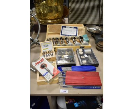 A small collection of woodworking tool accessories, to include Micro Router bits, and a drill bit set