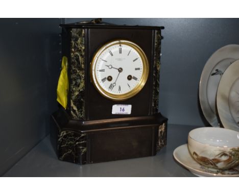 A 19th century marble mantel clock, having brass framed bevelled glass door with roman numerals to enamel face, W Roskell and