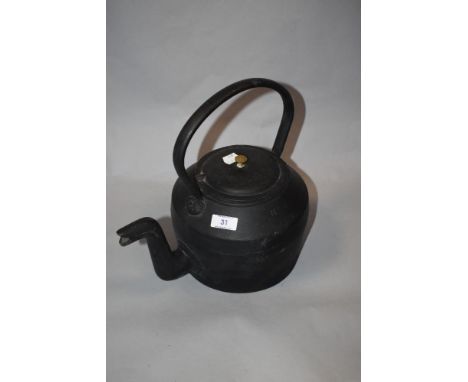 A vintage cast metal eight pint kettle, marked Swain.