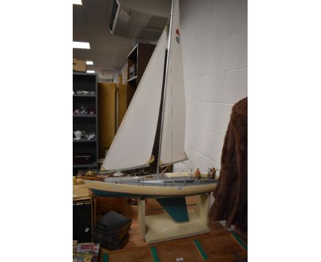 A vintage model boat on stand.