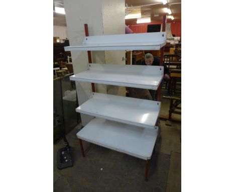 A metal four tier shelf 