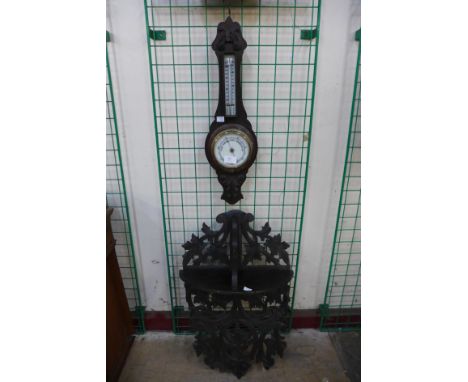 A Black Forest style wall bracket and an aneroid barometer 