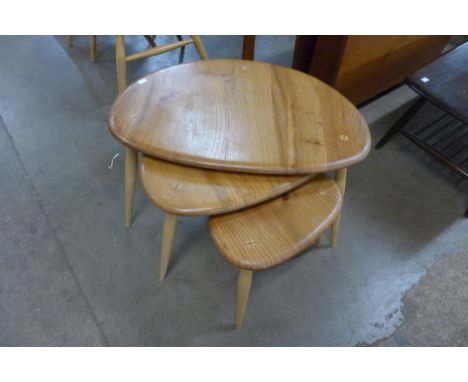 An Ercol Blonde elm and beech pebble shaped nest of tables