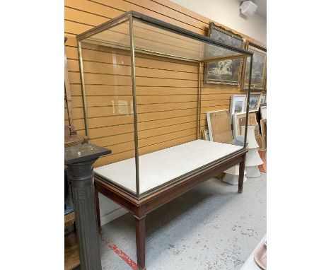 LARGE ANTIQUE BRASS FRAMED MUSEUM CABINET ON STAND, glazed on all sides with both large panes removeable. wood stand, 187 (w)