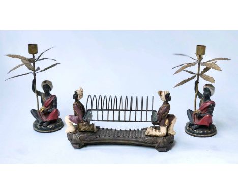 LETTER RACK, 20th century bronze and wirework with costumed beares together with a pair of conforming palm leaf candlesticks.