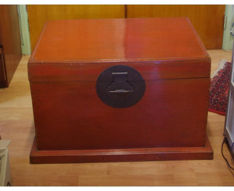 Oriental red lacquered trunk 89cm x 61cm, 53cm high