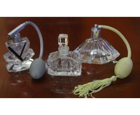 Three vintage cut crystal perfume bottles to include 2 Art Deco style both with puffers and 1 other with a stopper