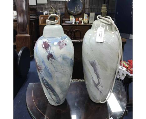 TWO NANCY SMILLIE CERAMIC LAMP BASESdecorated in pastel swirls on a cream ground, the tallest 44cm high