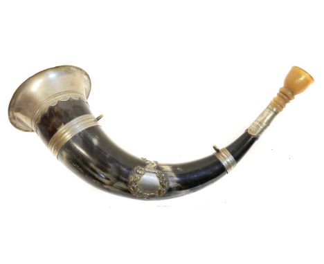 Hunting horn, with silver plated mounts, fitted with a laurel wreath cartouche topped with a stag head.30cm long 