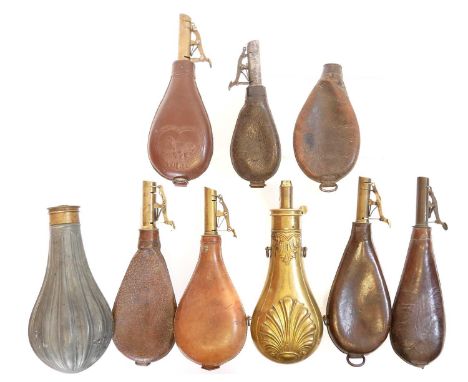 Six leather and brass shot flasks, one of which is stamped Dixon and sons, also a brass flask and two flask bodies without sp