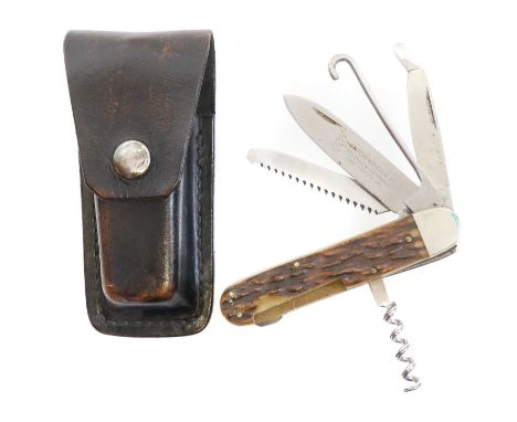 Anton Wingen Jr. Solingen Rostfrei pocket knife, with five tools/ blades, stag horn grips and leather pouch.THIS LOT CANNOT B