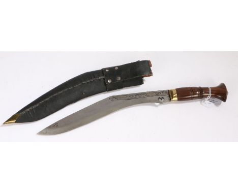 Decorative Kukri, wooden handle with brass bolster, held in leather covered wooden scabbard with brass chape, blade 29 cm