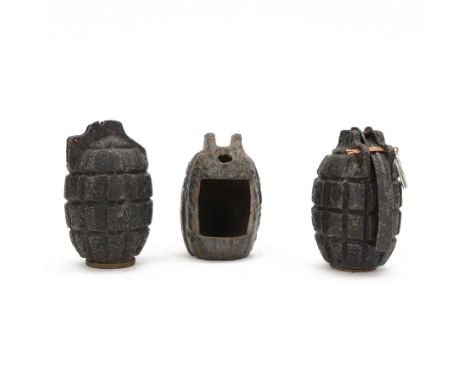 Three Inert Mills Grenade relic cases, two marked no 23 to the base