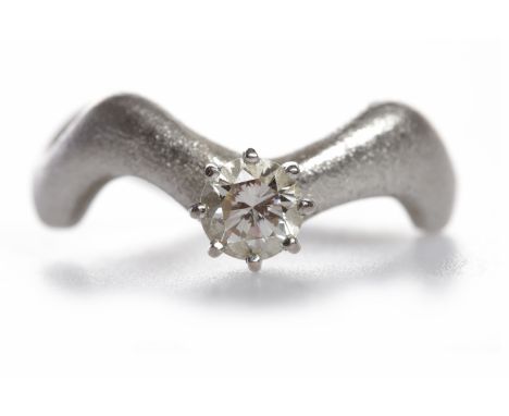 EIGHTEEN CARAT WHITE GOLD DIAMOND SOLITAIRE RINGthe eight claw set round brilliant cut diamond of approximately 0.70 carats o