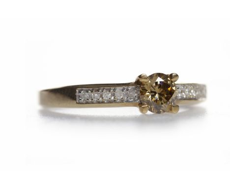 COGNAC DIAMOND RINGset with a single round brilliant cut cognac coloured diamond of approximately 0.48 carats, on white diamo