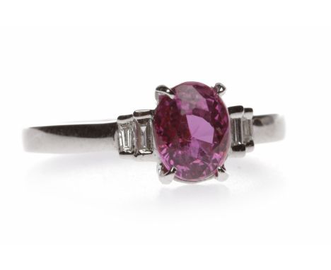 PINK SAPPHIRE AND DIAMOND RINGthe central oval cut pink sapphire of approximately 1.00 carat flanked by two graduated baguett