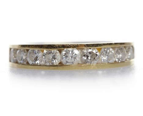 DIAMOND HALF ETERNITY RINGset with channel set round brilliant cut stones totalling approximately 1.00 carat, in eighteen car