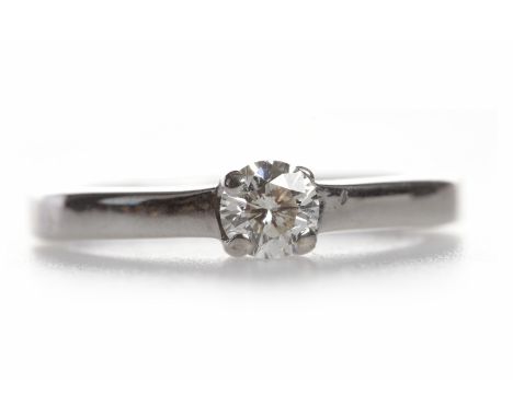 DIAMOND SOLITAIRE RINGthe round brilliant cut stone of approximately 0.29 carats in eighteen carat gold, size K, 3.6g