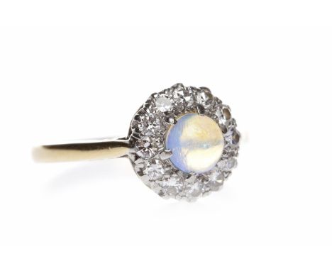 EARLY TWENTIETH CENTURY OPAL AND DIAMOND RINGthe central round cabochon cut opal 4.1mm diameter surrounded by round diamonds,