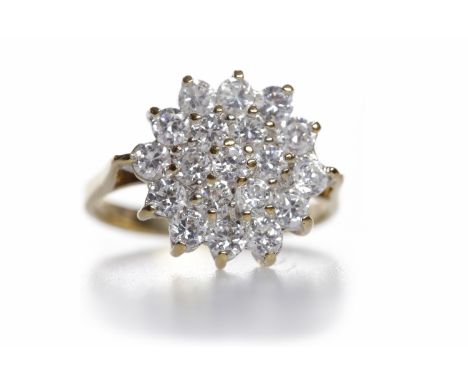 CUBIC ZIRCONIA CLUSTER RINGthe round white CZ stones set in daisy cluster motif bezel, on a nine carat gold tapered shank, si