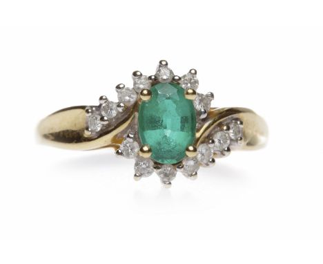 EMERALD AND DIAMOND RINGthe oval emerald 7mm long in a twist diamond set setting, in eighteen carat gold, size R, 3.3g