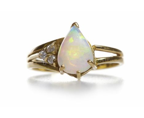 OPAL AND DIAMOND DRESS RINGthe central pear shaped opal with three round diamonds totalling approximately 0.03 carats to one 