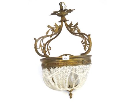 An ornate period style cast gilt metal ceiling light, 20th CenturyThe basket shaped glass beads suspended from circular rim a