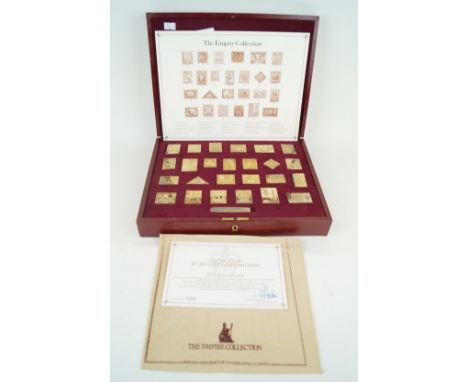 A cased set of silver gilt medals titled 'The First International Bank Ingot Collection'Comprising twenty five individual ing