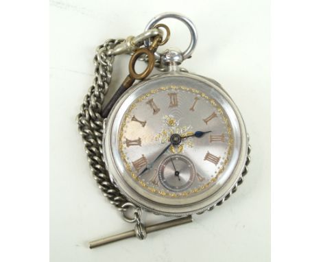 A late Victorian hallmarked silver pocket watchWith central filigree decoration and gilt Roman numerals, subsidiary seconds d