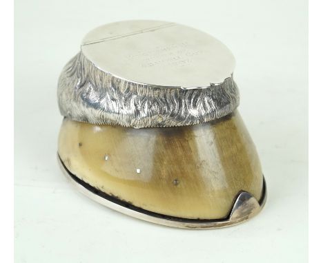 A Edward VII hallmarked silver mounted ink wellModelled in the form of a horses hoof, the engraved silver mounts with chased 