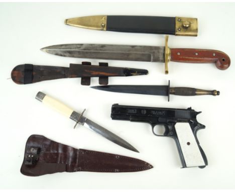 A Fairburn-Sykes second pattern fighting knife mid 20th Century 18½cm blackened straight double edged blade, with straight cr