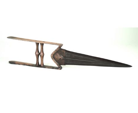 An Indian Katar, late 17th/early 18th CenturyThe 23cm straight tapering double edged blade with traces of copper finish, blad