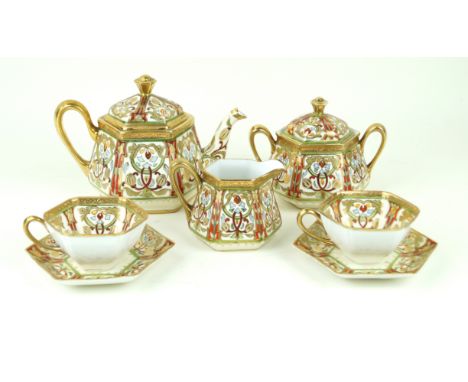 A Noritake hand-painted four setting tea serviceHaving geometric motifs inside gilt rims, comprising tea pot and cover, twin 