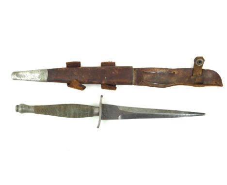 A Fairburn-Sykes first pattern fighting knife c.194016cm straight double edged blade, with acid etched decoration The F-S fig