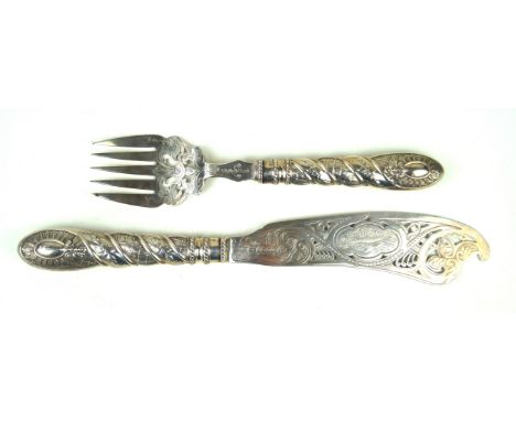 A Victorian hallmarked silver fish serversEach having pierced and engraved decoration depicting fish, scrolls and foliate, by