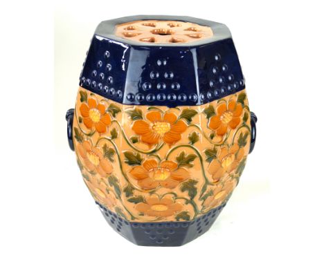 A 19th Century Minton octagonal garden seatRelief decorated with peonies in shades of brown, green, yellow and blue with two 