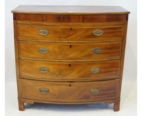 An early 19th Century mahogany bow front chest of drawersThe four graduated cross banded drawers applied with brass drop hand