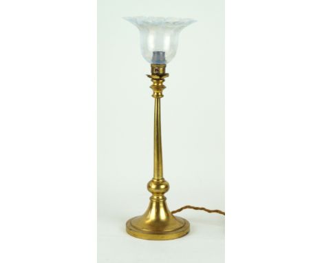 A decorative brass table lamp with milk glass shade Raised on a single knop support, height including shade 43cm 