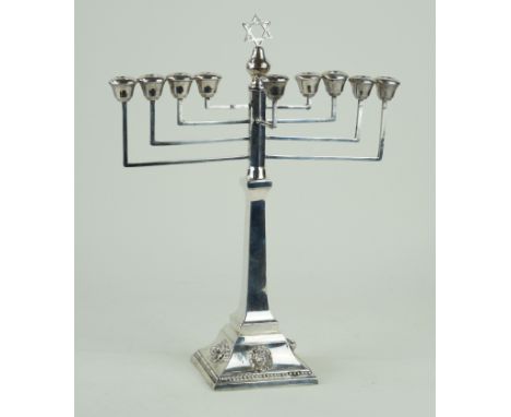 A George V hallmarked silver menorah With four relief lion mask heads to foot rim, by A Taite & Sons Ltd, London 1933, approx