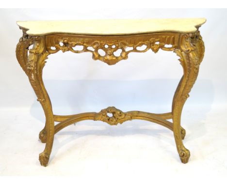 An ornate Georgian revival gilt gesso finished carved wood console table with marble top, 20th CenturyThe serpentined outline