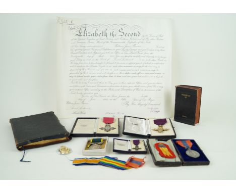 A cased first type Britannia silver gilt MBE awarded to James BarnesTogether with the cased miniature MBE, further cased seco