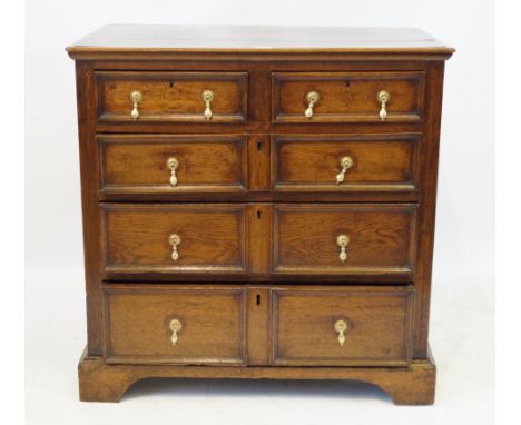 A 17th Century oak chest of drawers in the Jacobean tasteThe two short and three long graduated drawers applied with geometri