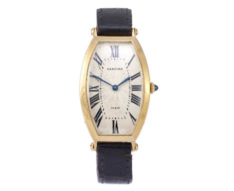 Cartier: A Rare Tonneau Shaped 18 Carat Gold Wristwatch, signed Cartier, Paris, model: Tonneau, circa 1970, manual wound leve