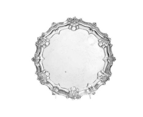 A George V Silver Salver,  by William Hutton and Sons Ltd., Sheffield, 1919 in the George II style, shaped circular and on th