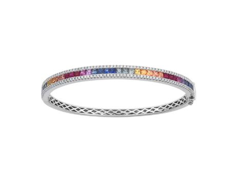 An 18 Carat White Gold Sapphire and Diamond Banglethe calibré cut sapphires depicting the colours of the rainbow in channel s